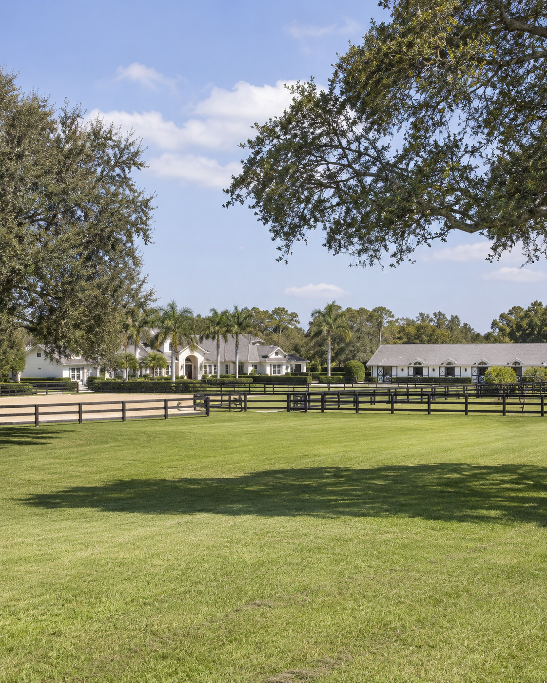 Equestrian estate with stable and white-fenced paddocks in Equestrian Club Estates, Wellington