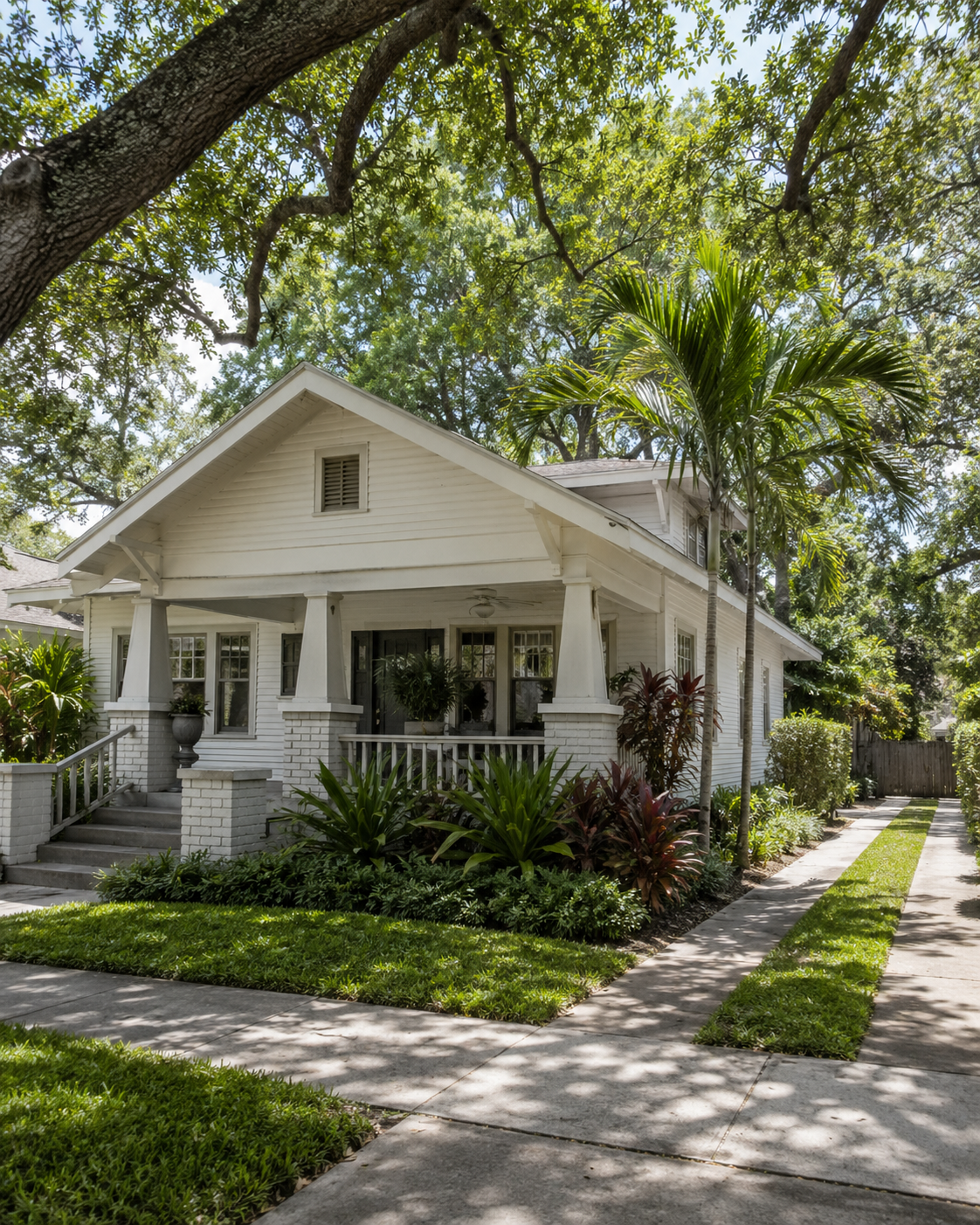1920s bungalow under mature oaks in the Prospect Park neighborhood, West Palm Beach